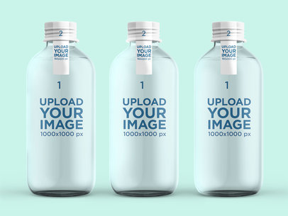 Mockup of Three Glass Water Bottles in a Plain Setting 3061-el1