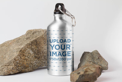 Mockup of an Aluminum Bottle Surrounded by Rocks