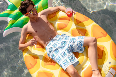 Mockup of a Young Man Wearing Swim Trunks at the Pool