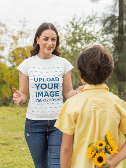 Mockup Featuring a Happy Mother Wearing a T-Shirt and His Son Holding Some Flowers 