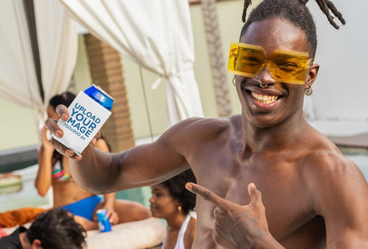 Mockup of a Man Pointing at a Koozie by a Pool 
