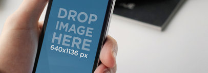 iPhone 5s Held By A Man Wide