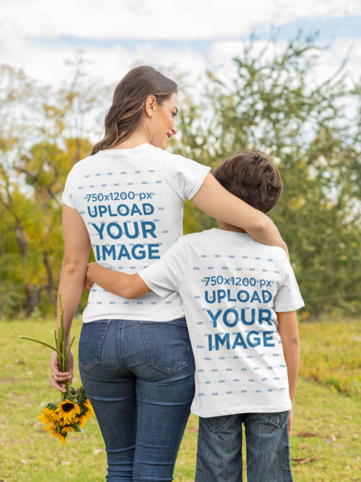 Back View T-Shirt Mockup Featuring a Mom and Son Hugging in the Park