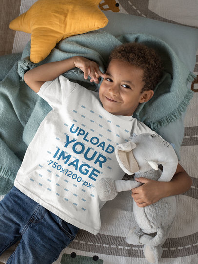 T-Shirt Mockup Featuring a Kid Hugging His Cuddly Toy