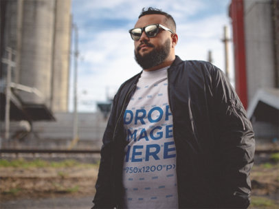 T-Shirt Mockup of a Cool Young Man Wearing Sunglasses