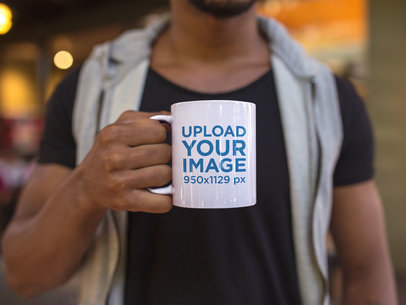 Young Man Holding a Coffee Mug Mockup