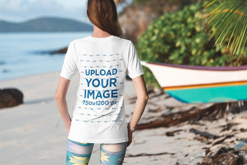 Back View Mockup of a Woman Wearing a Customizable T-Shirt by the Sea 