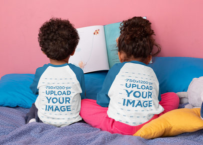 Back View Raglan T-Shirt Mockup Featuring Two Toddlers Sitting on a Bed 