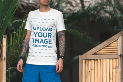 T-Shirt Mockup of a Tattooed Man on Vacation