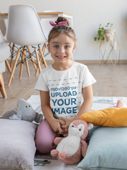 T-Shirt Mockup Featuring a Smiling Girl at Home