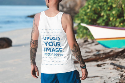 Tank Top Mockup of a Tattooed Man Facing Towards the Sea