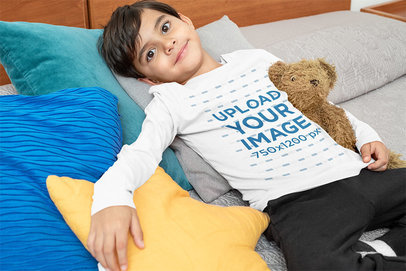 Mockup of a Boy with a Long-Sleeve Tee Lying on a Bed 