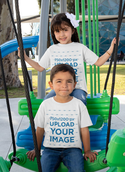 T-Shirt Mockup Featuring Two Kids Having Fun at a Playground