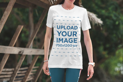 T-Shirt Mockup of a Woman with Nature in the Background