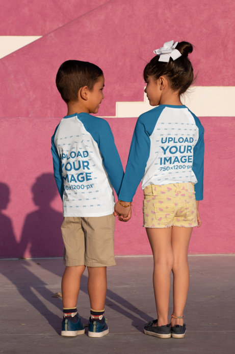 Back-View Mockup of Two Siblings Wearing Raglan T-Shirts