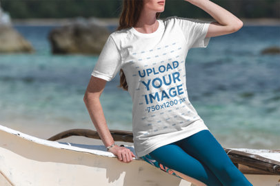 T-Shirt Mockup of a Woman at the Beach on a Sunny Day