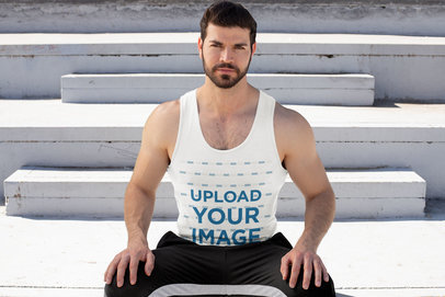 Tank Top Mockup Featuring a Muscled Man by a Concrete Stairway