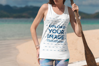 Tank Top Mockup of a Young Woman Holding an Oar at the Beach