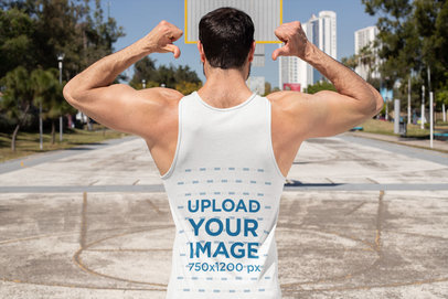 Back View Mockup Featuring a Muscled Man Pointing at His Sleeveless Shirt