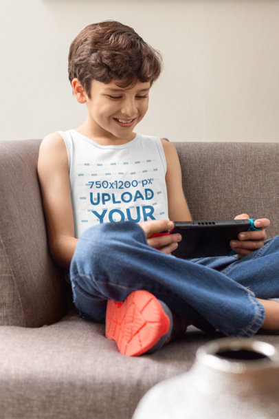 Tank Top Mockup of a Happy Kid Playing Video-Games at Home 