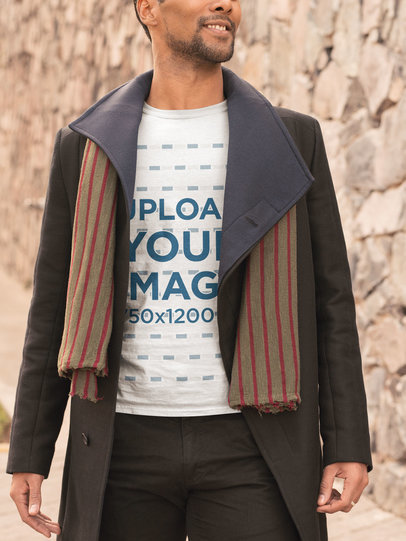 T-Shirt Mockup Featuring a Bearded Man Walking on a Cold Day 