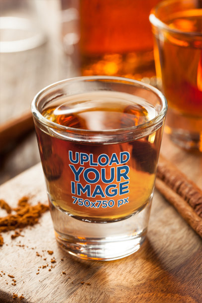 Mockup of a Shot Glass With Whiskey in It 