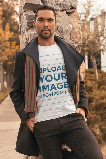 T-Shirt Mockup Featuring a Stylish Man with an Overcoat