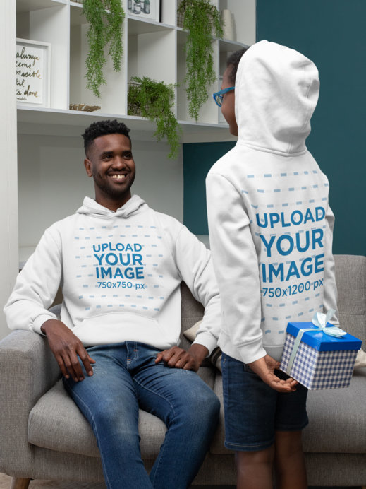 Hoodie Mockup Featuring a Boy Hiding a Present From His Dad