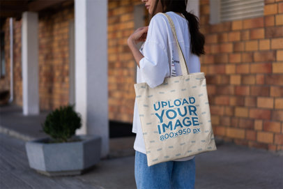 Mockup of a Woman with a Tote Bag Walking on a Hallway 3133-el1