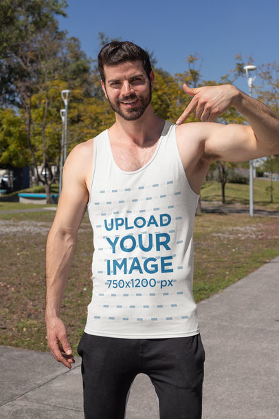 Mockup of a Fitness Man Pointing at His Muscle Shirt