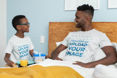 T-Shirt Mockup Featuring a Boy Serving Breakfast to His Dad on Father's Day