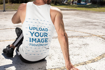 Back-View Mockup of a Man Stretching with a Tank Top