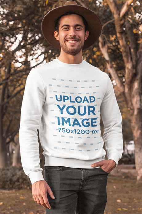 Crewneck Sweatshirt Mockup of a Man Posing at a Park During Autumn