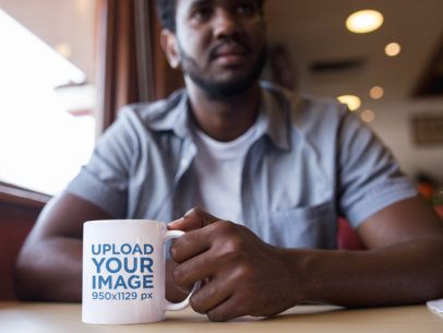 Coffee Mug Mockup of a Man at a Diner