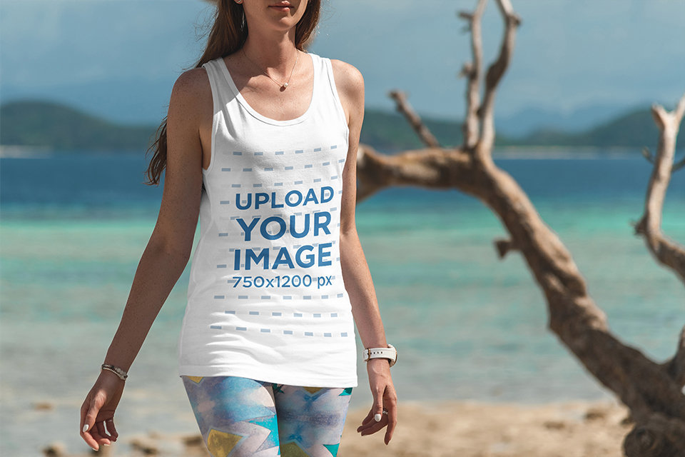 Tank Top Mockup of a Woman Taking a Stroll at the Beach
