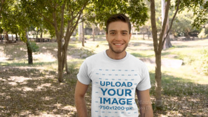 T-Shirt Video of a Man Walking Through a Park