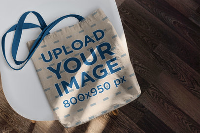 Mockup of an Empty Tote Bag Placed on a Table