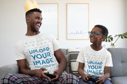 T-Shirt Mockup of Father and Son Playing Videogames at Home