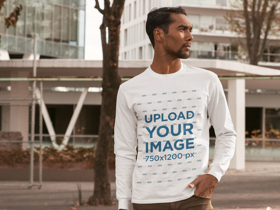 Mockup of a Serious Man Wearing a Customizable Long Sleeve Tee in the City 