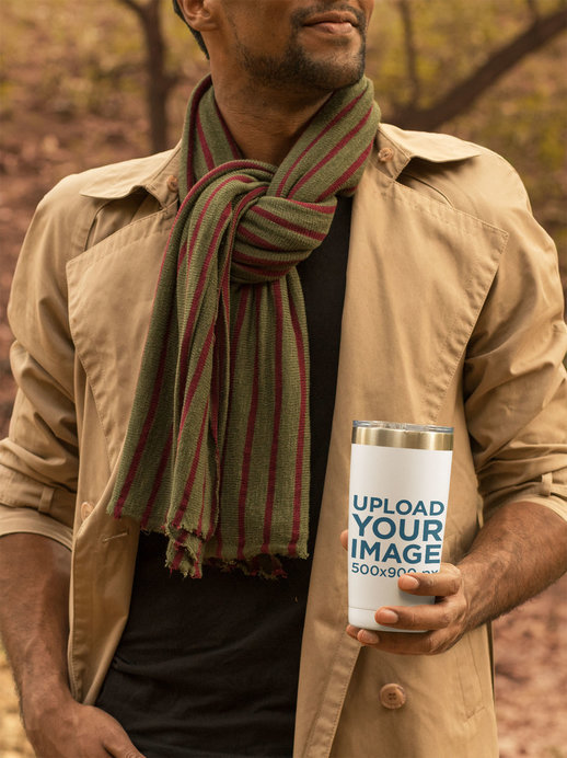 Mockup of a Young Man Holding a Travel Mug