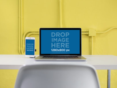 MacBook and iPhone 6 Mockup in a Modern Yellow Office