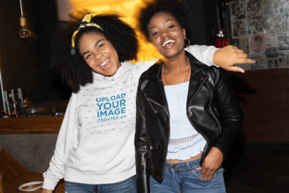 Pullover Hoodie Mockup Featuring Two Happy Friends on a Girls Night Out