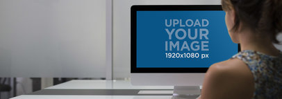 iMac Mockup of a Young Woman in her Office