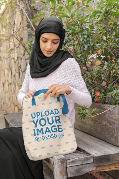 Mockup of a Woman Looking Inside a Sublimated Tote Bag 32383