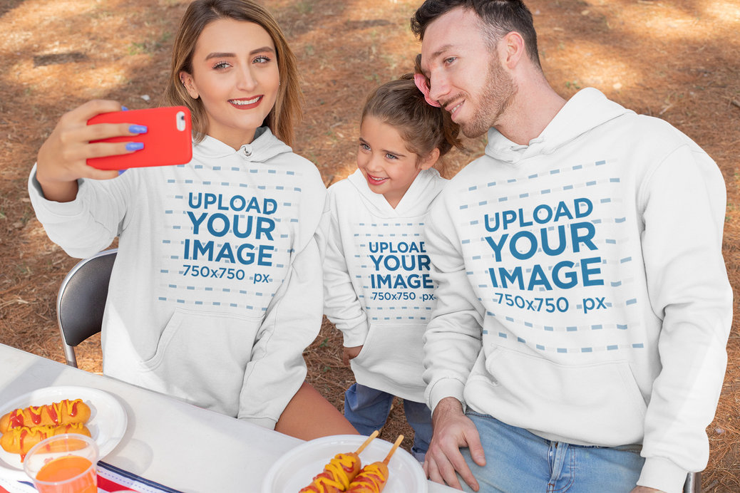 Hoodie Mockup of a Family Taking a Selfie on 4th of July