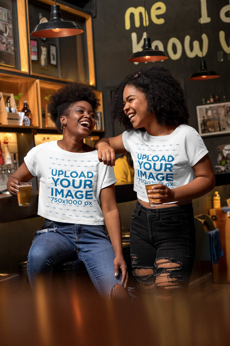 Mockup of Two Friends with Crop Tops at a Bar 