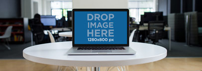 MacBook Pro Mockup on a White Table in a Modern Office