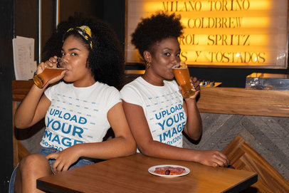 T-Shirt Mockup of Two Women Drinking Beer at a Bar