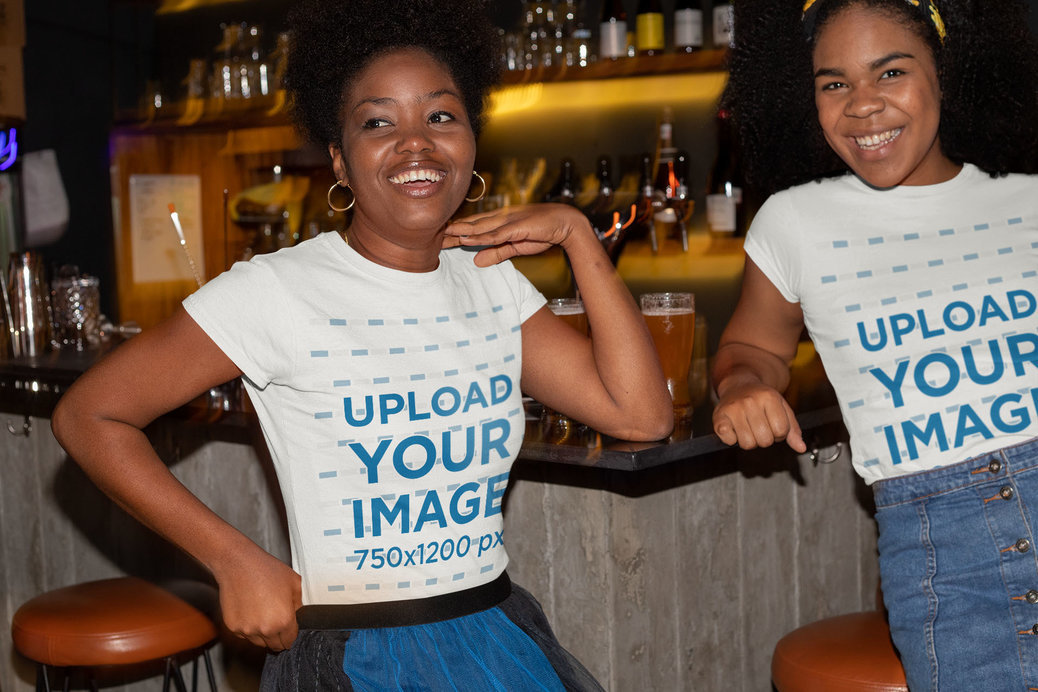 T-Shirt Mockup of Two Girl Friends Hanging Out at a Bar 