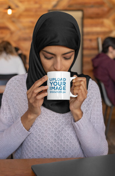 11 oz Mug Mockup of a Woman Wearing a Hijab and Drinking Coffee